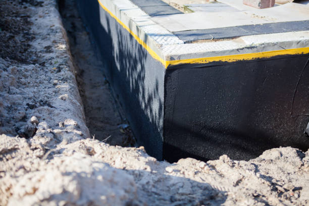 Professional Basement Waterproofing technician working in Greendale, IN